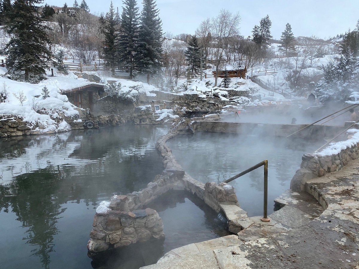 a lake surrounded by snow