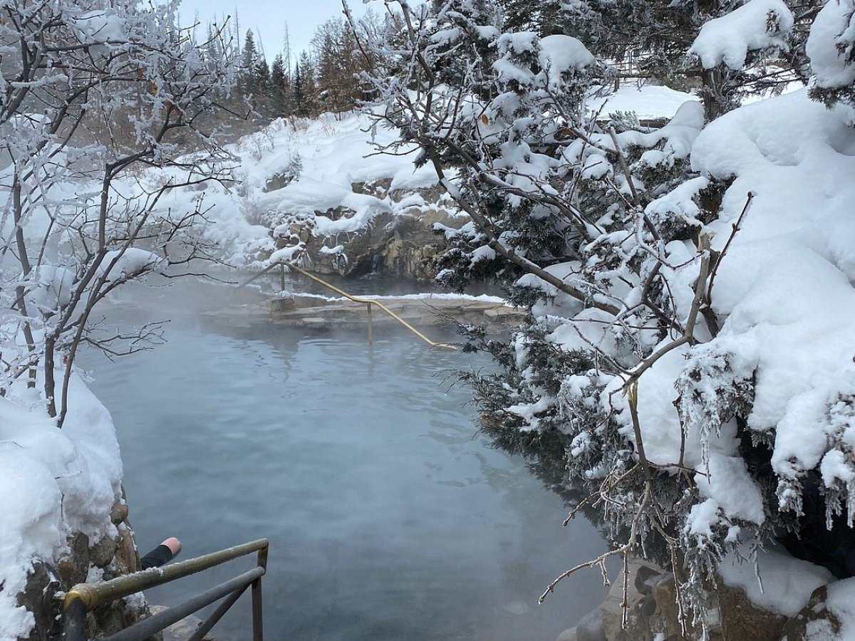 a lake surrounded by snow