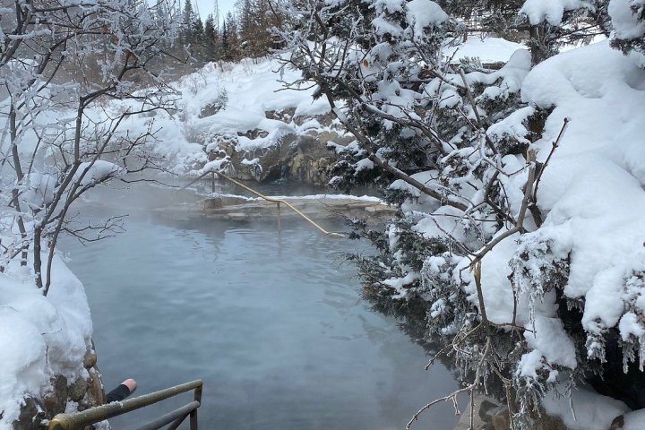 a lake surrounded by snow